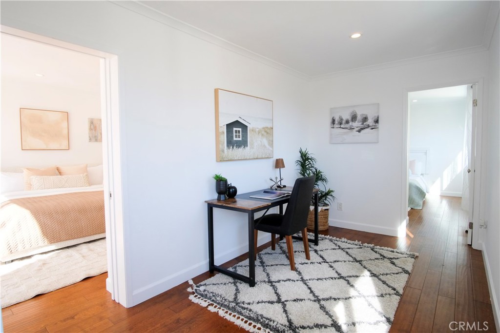 2015 Bataan Road, Unit 102 Redondo Beach, CA 90278 - Photo 27 of 43 a view of a workspace with furniture and wooden floor