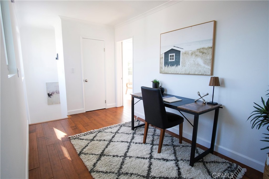 2015 Bataan Road, Unit 102 Redondo Beach, CA 90278 - Photo 28 of 43 a view of a workspace room with furniture and wooden floor