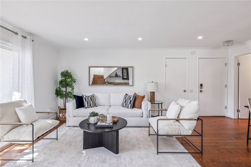 2015 Bataan Road, Unit 102 Redondo Beach, CA 90278 - Photo 3 of 43 a living room with furniture and a potted plant