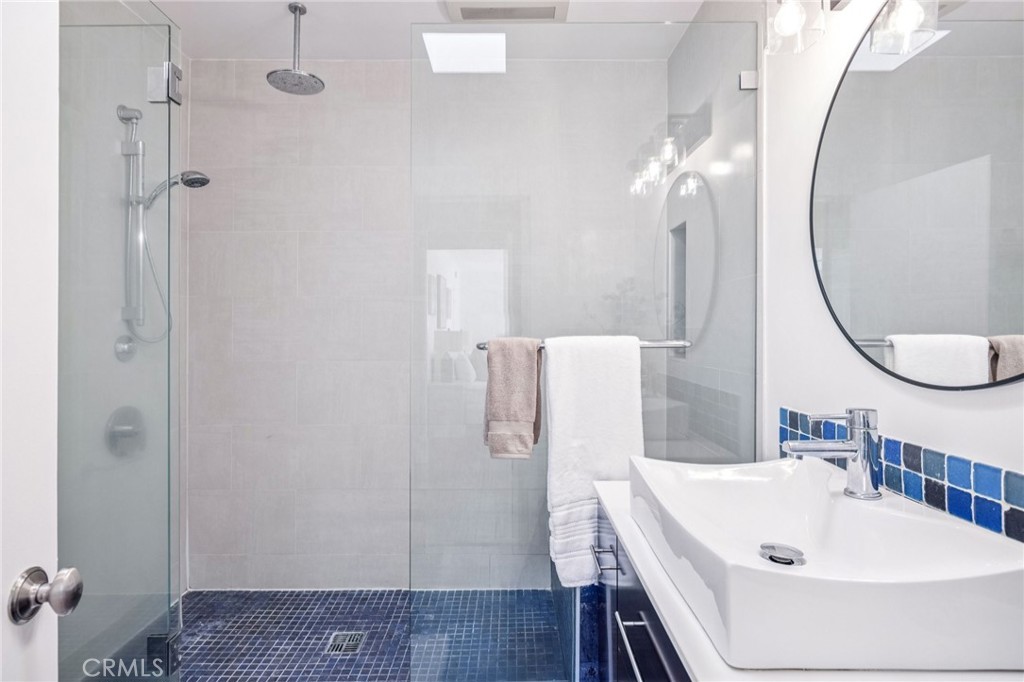 2015 Bataan Road, Unit 102 Redondo Beach, CA 90278 - Photo 33 of 43 a bathroom with a sink a toilet and shower