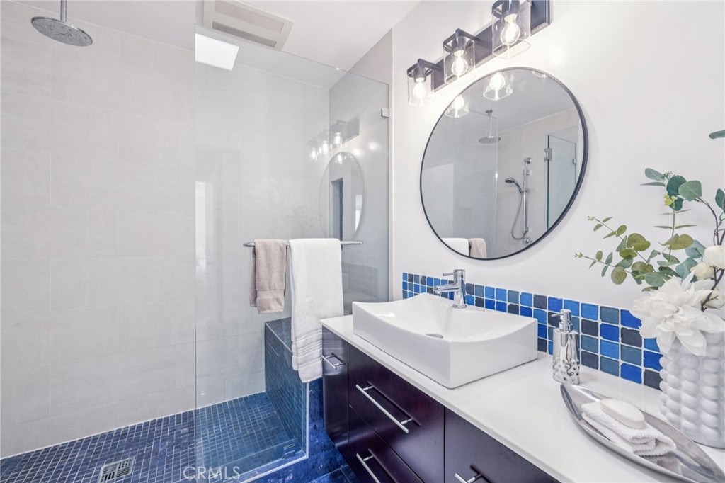 2015 Bataan Road, Unit 102 Redondo Beach, CA 90278 - Photo 34 of 43 a bathroom with a sink and a mirror