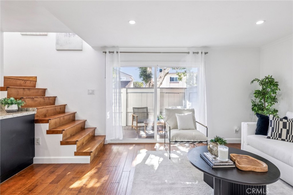 2015 Bataan Road, Unit 102 Redondo Beach, CA 90278 - Photo 5 of 43 a living room with furniture and wooden floor