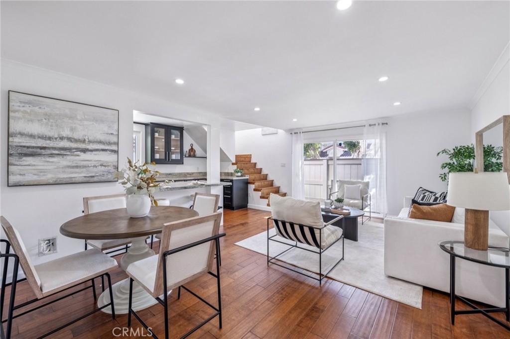 2015 Bataan Road, Unit 102 Redondo Beach, CA 90278 - Photo 7 of 43 a living room with furniture and a wooden floor