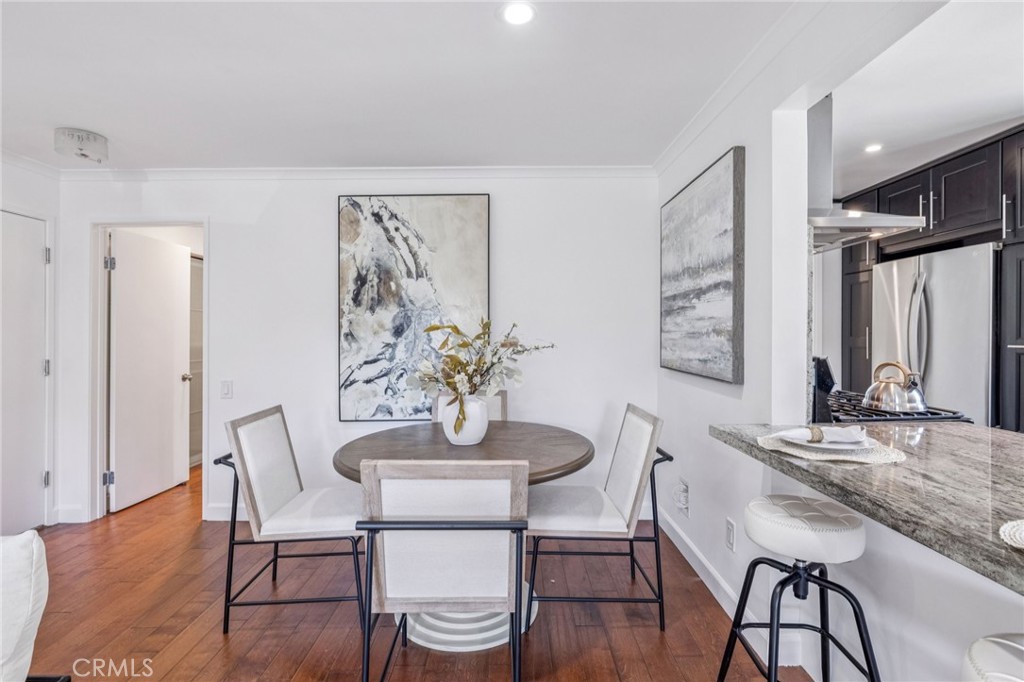 2015 Bataan Road, Unit 102 Redondo Beach, CA 90278 - Photo 8 of 43 a dining room with furniture and wooden floor