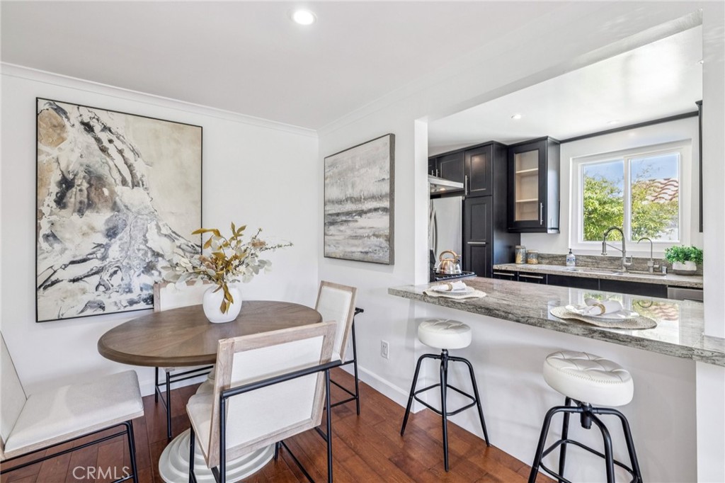 2015 Bataan Road, Unit 102 Redondo Beach, CA 90278 - Photo 9 of 43 a dining room with furniture and window