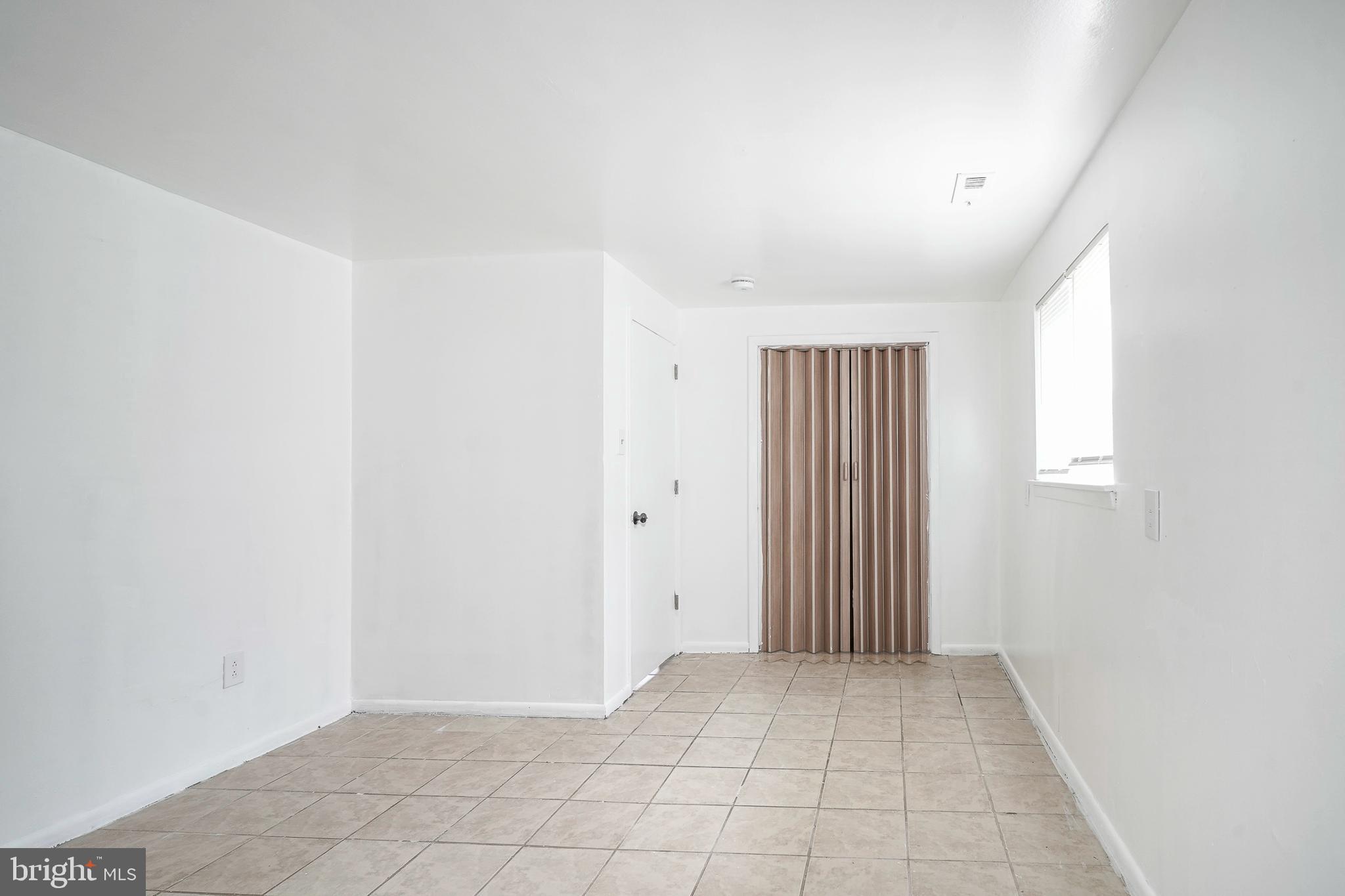 220 College Drive Pemberton, NJ 08068 - Photo 20 of 28 an empty room with windows