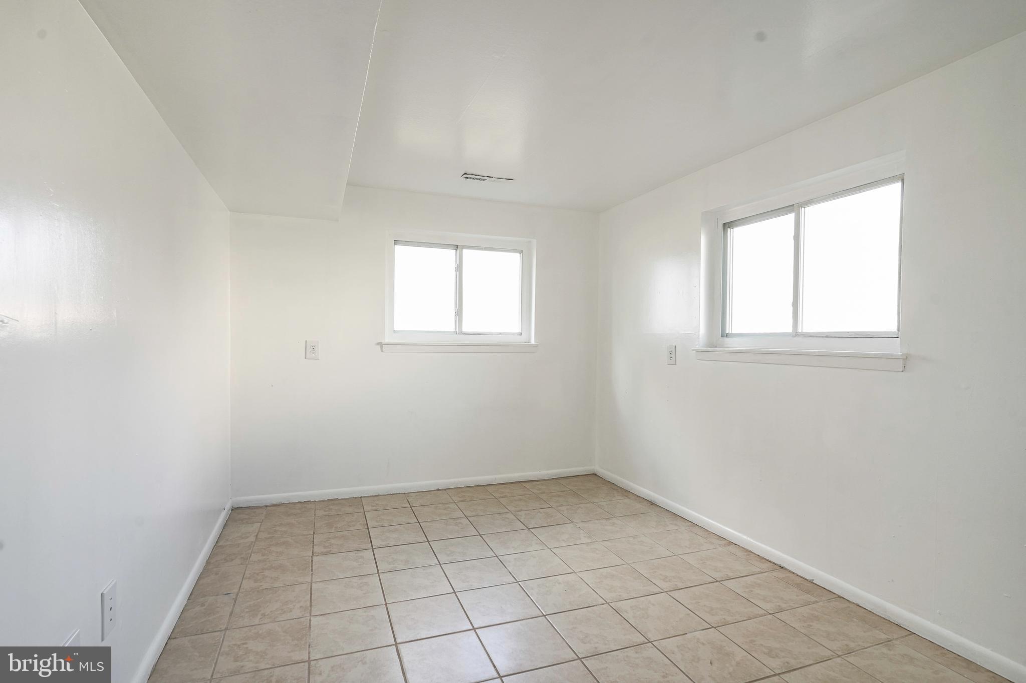 220 College Drive Pemberton, NJ 08068 - Photo 22 of 28 an empty room with windows