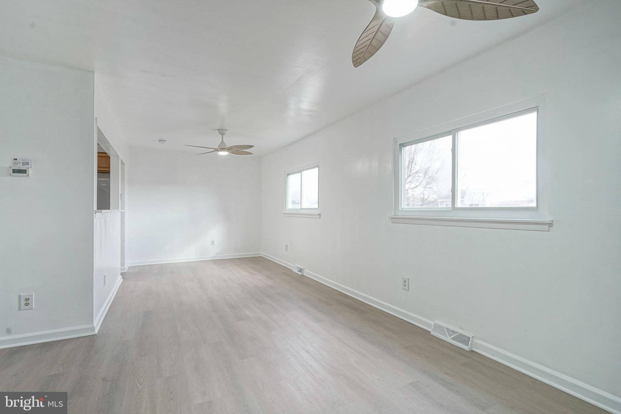 220 College Drive Pemberton, NJ 08068 - Photo 4 of 28 wooden floor in an empty room with a window