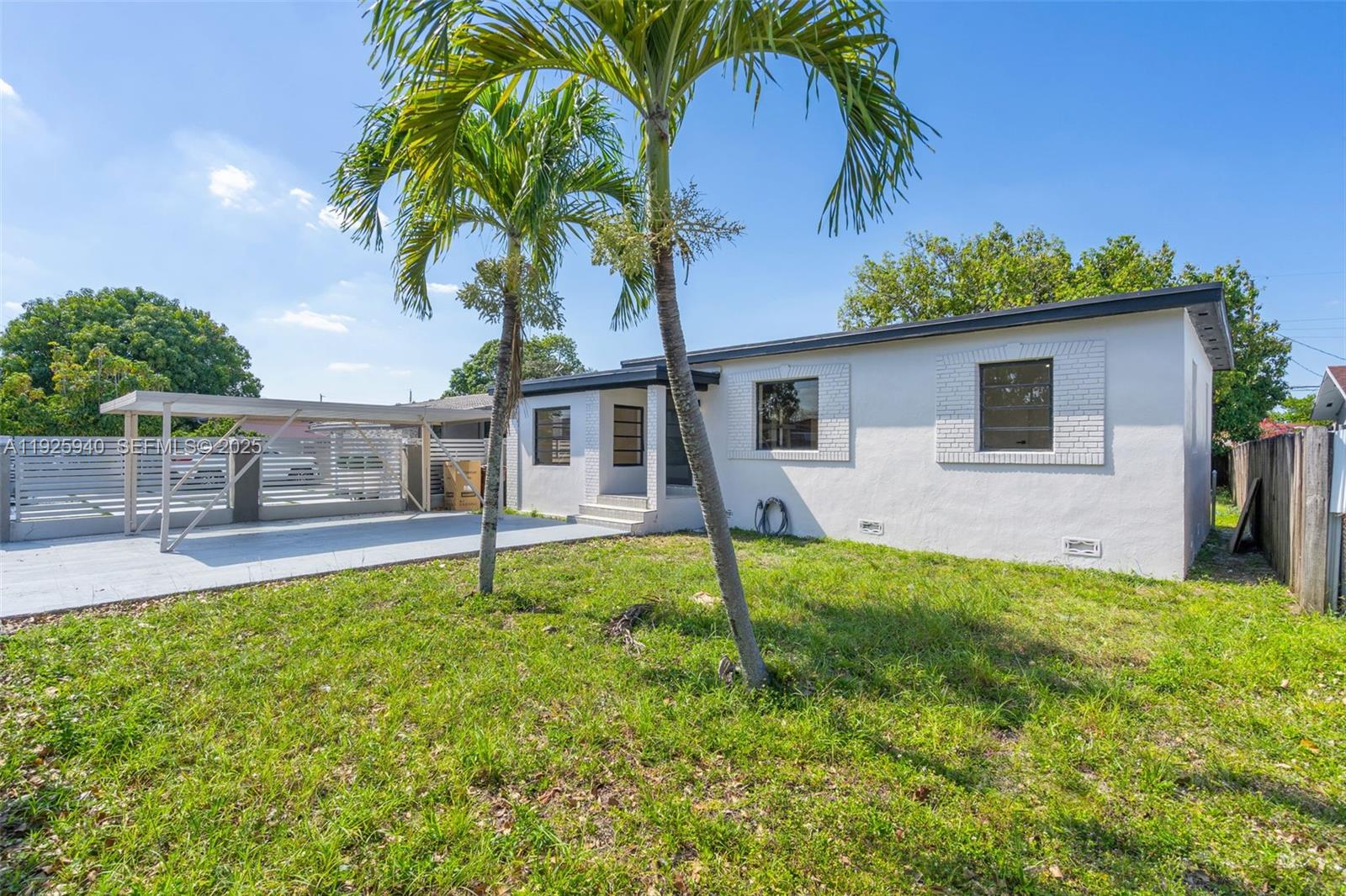 739 West 30th Street Hialeah, FL 33012 - Photo 2 of 23 a house view with a garden space