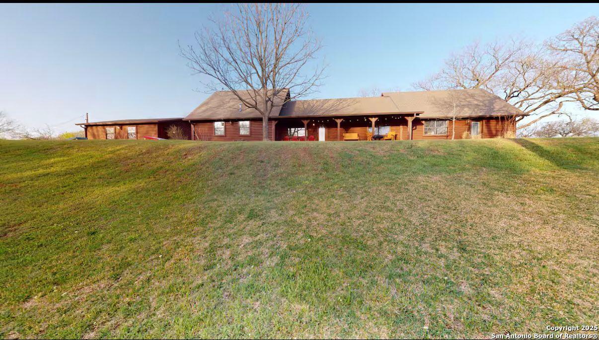 81 Butler Lane Martindale, TX 78655 - Photo 12 of 15 a front view of a house with a garden