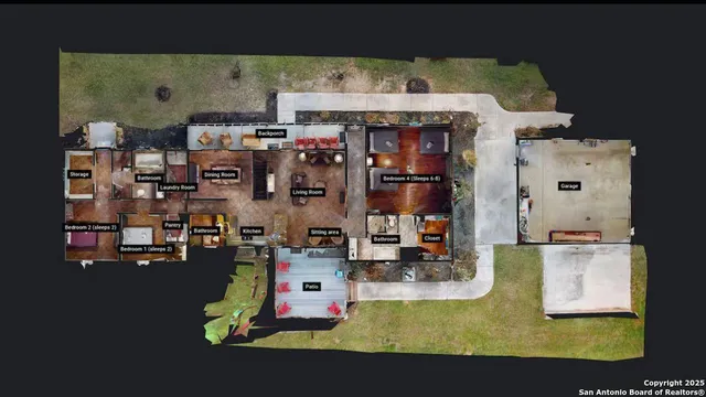 a car parked in front of a house with a yard