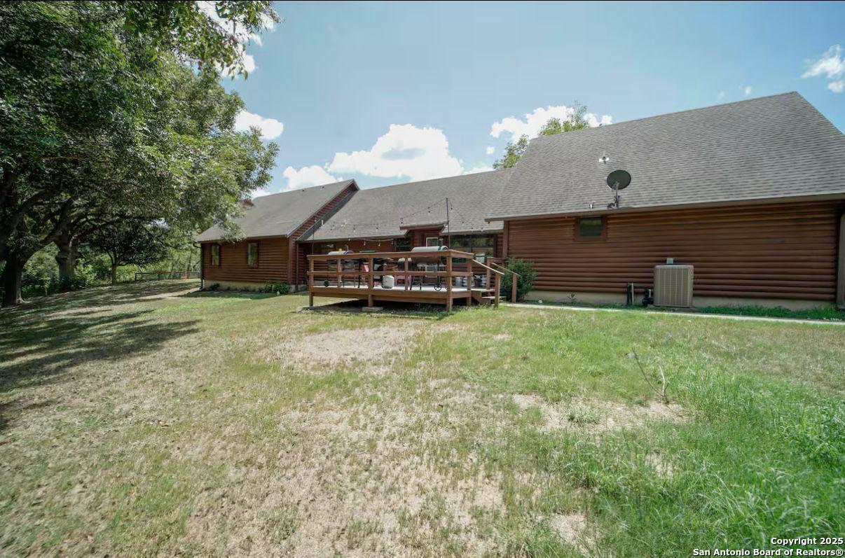 81 Butler Lane Martindale, TX 78655 - Photo 14 of 15 a car parked in front of a house with a yard