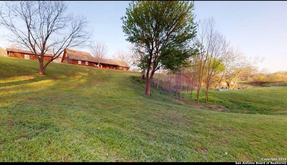 81 Butler Lane Martindale, TX 78655 - Photo 15 of 15 a backyard of a house with lots of green space