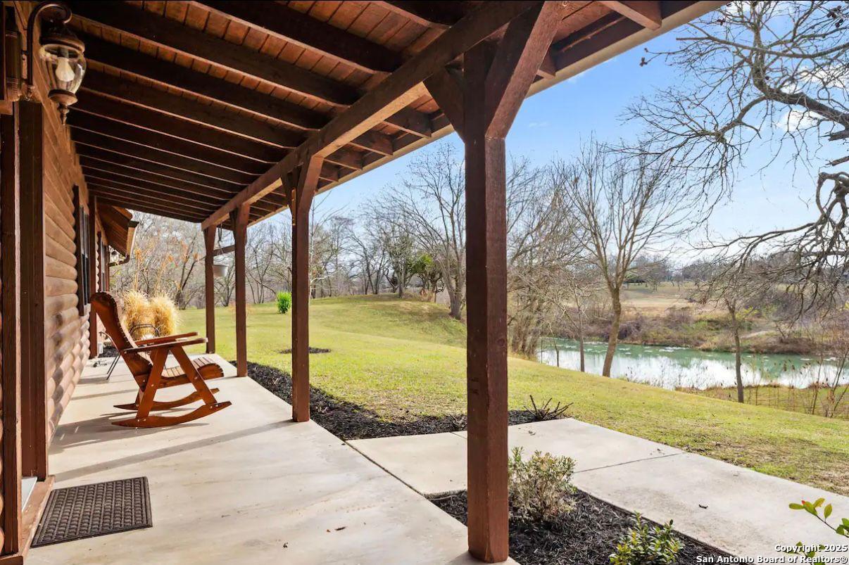 81 Butler Lane Martindale, TX 78655 - Photo 2 of 15 a view of a porch with furniture and garden view