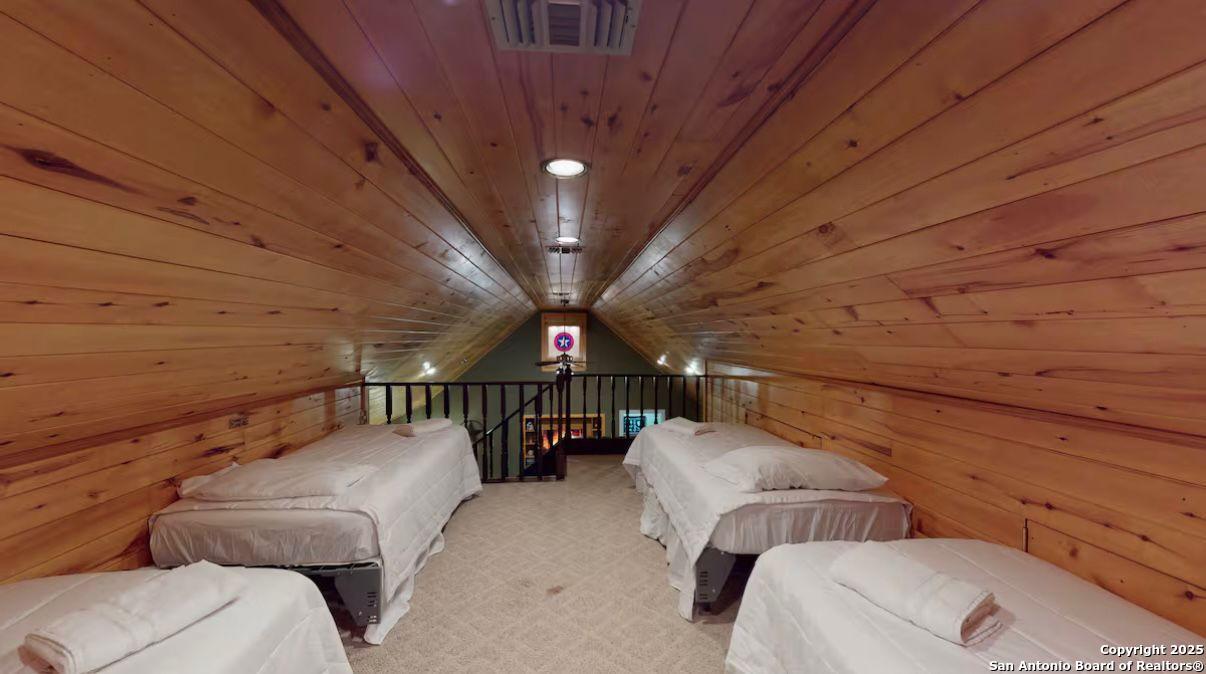 81 Butler Lane Martindale, TX 78655 - Photo 6 of 15 a view of a hallway with couches and large trees