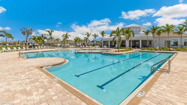 a view of a swimming pool with a table and chairs