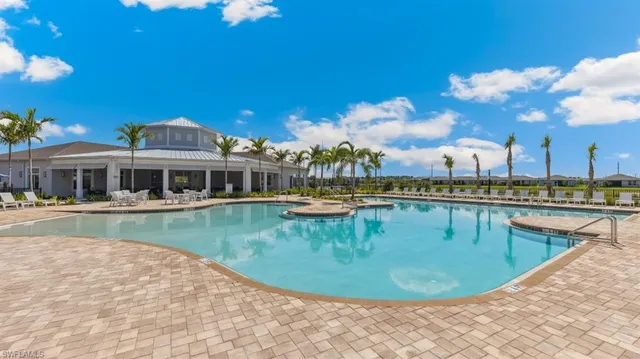 a view of a swimming pool with a chair
