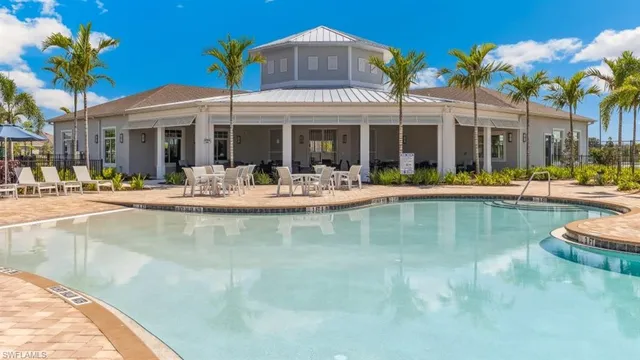 a swimming pool with outdoor seating yard and balcony