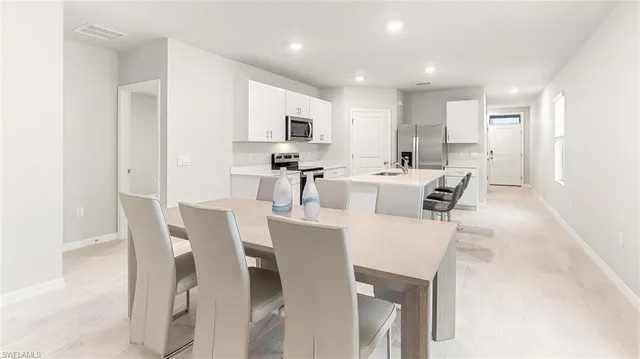 a view of a dining room with furniture