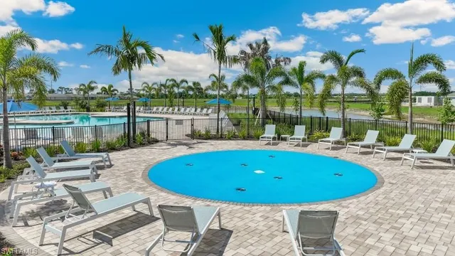 a view of a swimming pool with a patio