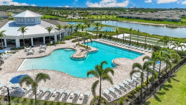 an aerial view of a house with garden space and lake view