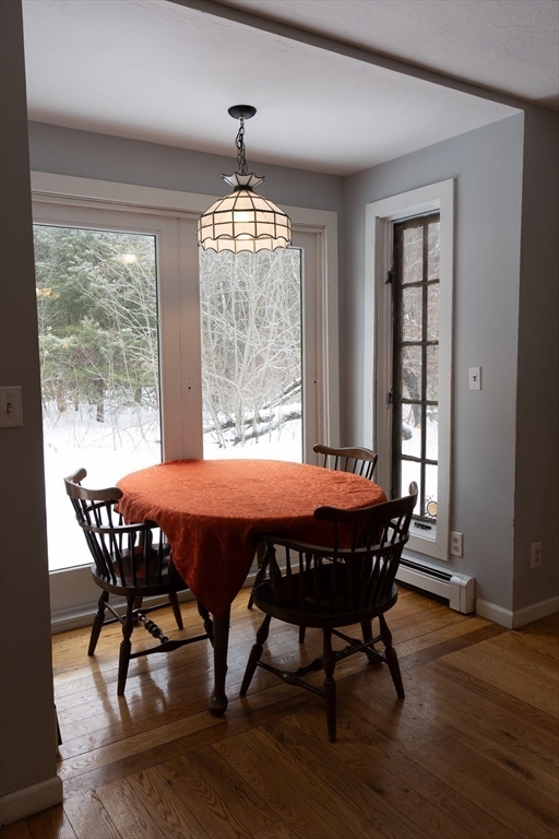 20 Paige Hill Road Brimfield, MA 01010 - Photo 19 of 40 a view of a dining room with furniture wooden floor and chandelier
