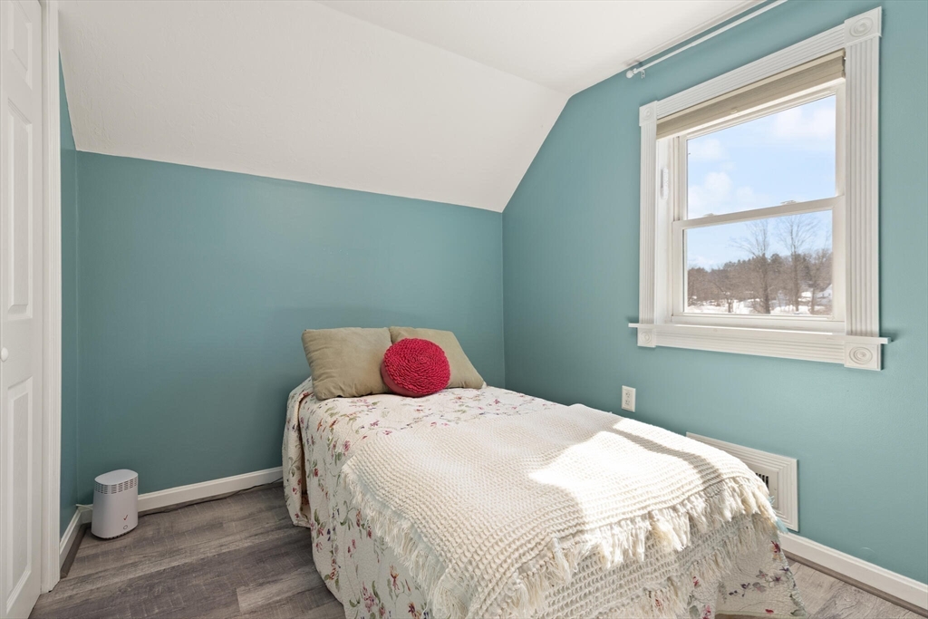 19 Cherry Street Hudson, MA 01749 - Photo 19 of 28 a bedroom with a bed and a window