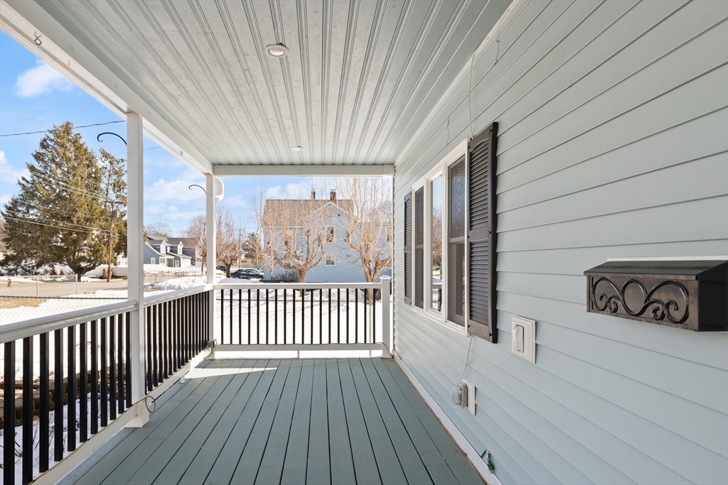 19 Cherry Street Hudson, MA 01749 - Photo 2 of 28 a view of a porch with wooden floor