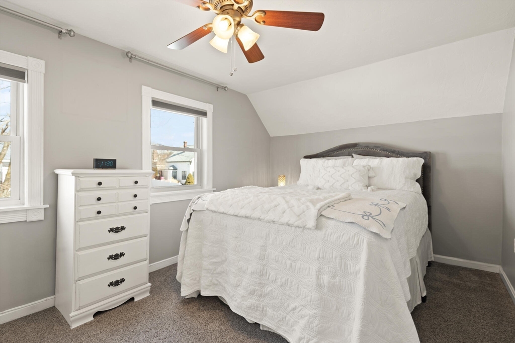 19 Cherry Street Hudson, MA 01749 - Photo 21 of 28 a bedroom with a bed and a window