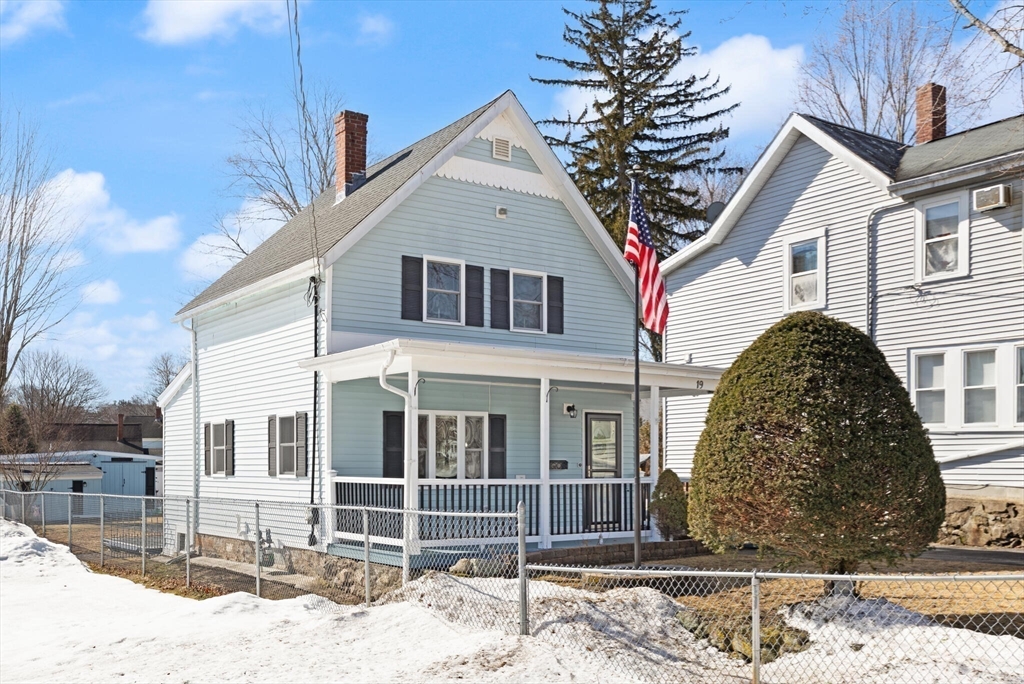 19 Cherry Street Hudson, MA 01749 - Photo 28 of 28 a front view of a house with a yard