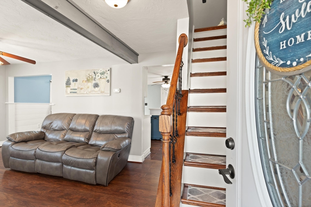19 Cherry Street Hudson, MA 01749 - Photo 3 of 28 a living room with furniture and a fireplace