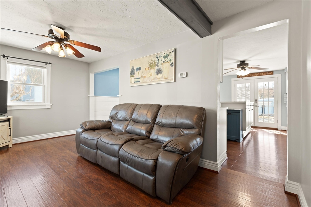 19 Cherry Street Hudson, MA 01749 - Photo 4 of 28 a living room with furniture and a wooden floor