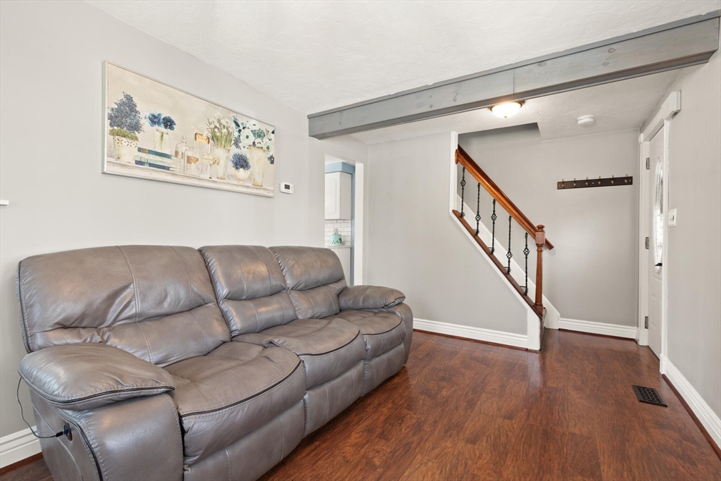 19 Cherry Street Hudson, MA 01749 - Photo 5 of 28 a living room with furniture and a wooden floor