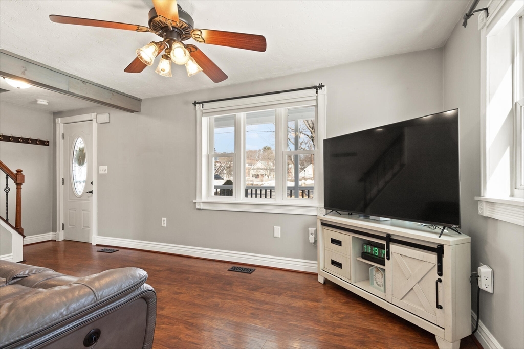19 Cherry Street Hudson, MA 01749 - Photo 6 of 28 a living room with furniture and flat screen tv