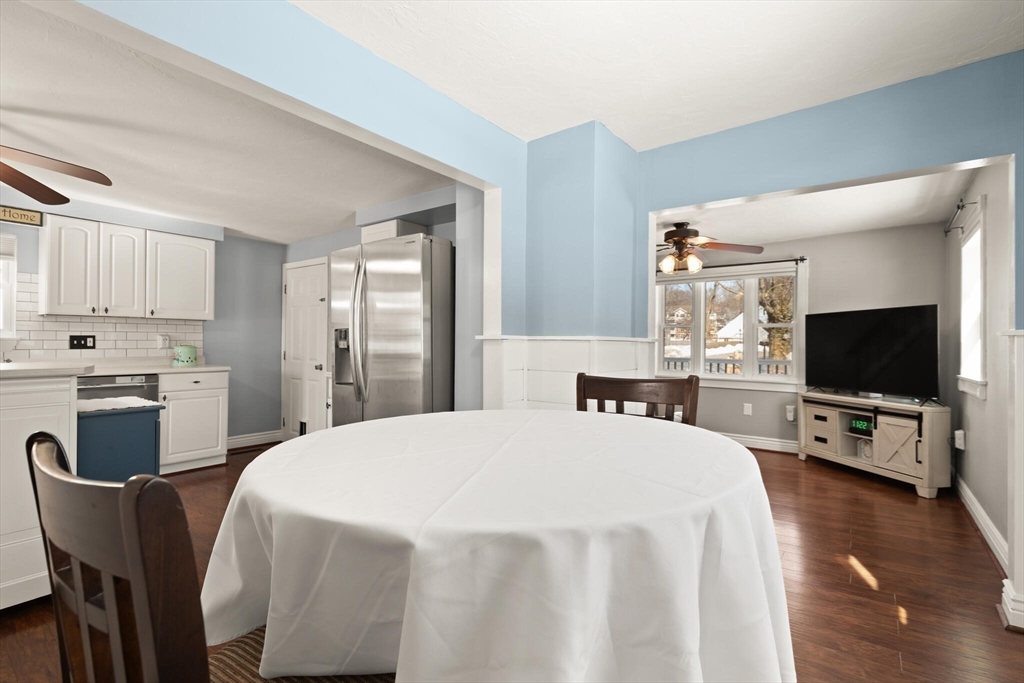 19 Cherry Street Hudson, MA 01749 - Photo 7 of 28 a bedroom with a bed and a flat screen tv