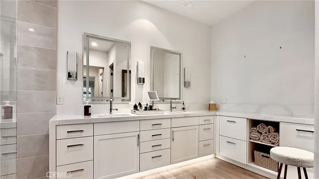 a bathroom with a double vanity sink mirror and double
