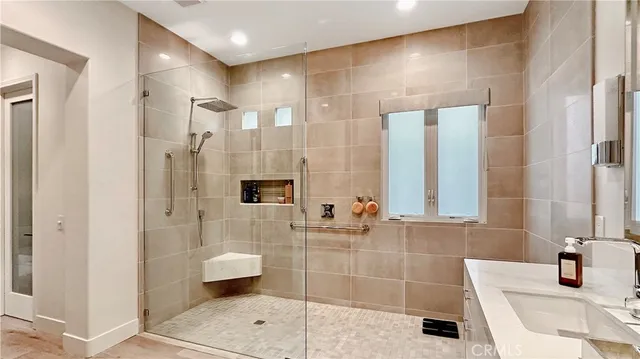a bathroom with a bathtub shower sink and toilet