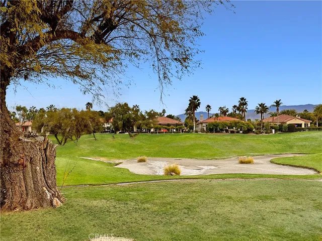 a view of a golf course with a lake