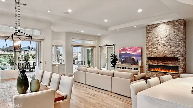a living room with fireplace furniture and a flat screen tv
