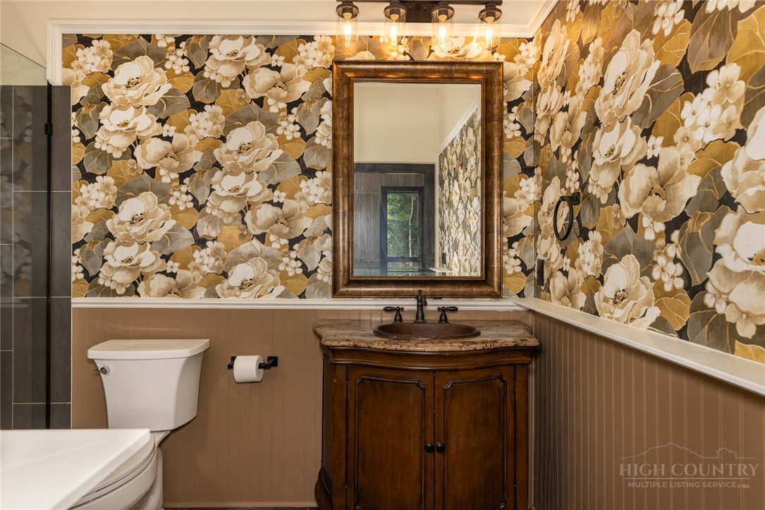790 Howard Edmisten Road Sugar Grove, NC 28679 - Photo 17 of 45 a bathroom with a sink and a toilet