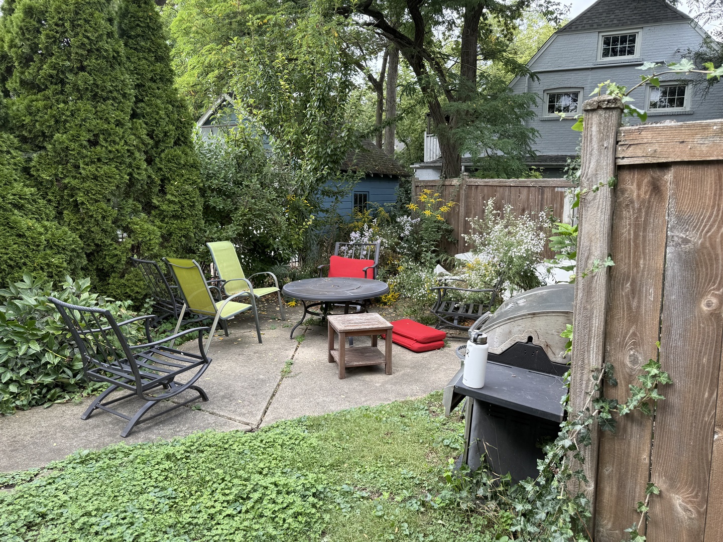 979 Vine Street Winnetka, IL 60093 - Photo 11 of 18 a view of a chairs and table in backyard of the house