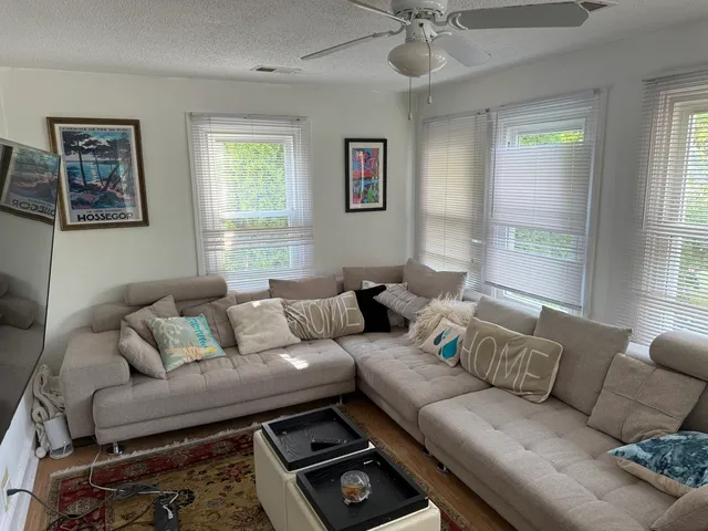 a living room with furniture and a window