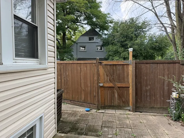a view of house with wooden fence