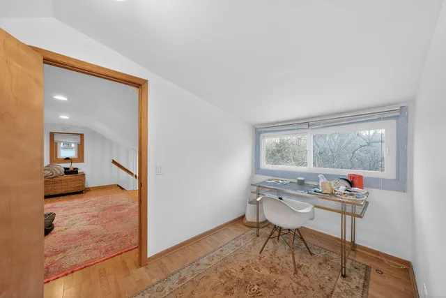 a workspace with furniture and a window