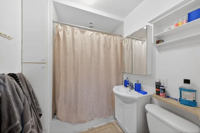 a storage room with a window and a couch