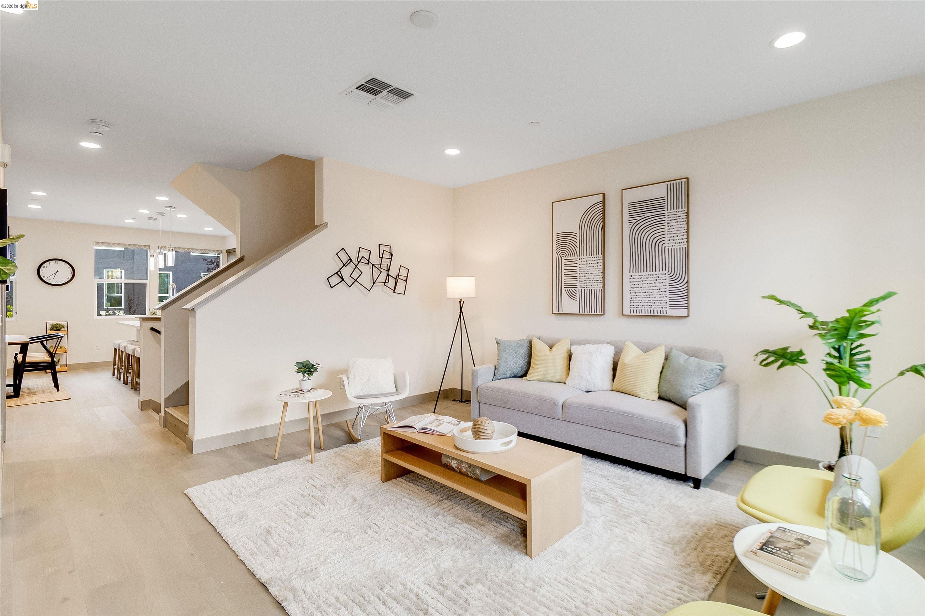 1357 Pullman Way Oakland, CA 94607 - Photo 17 of 37 Open-concept living area with light wood-finish flooring, recessed lighting, and a neutral color palette