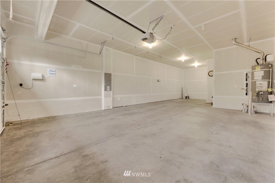 6117 Northeast 1st Street Renton, WA 98059 - Photo 14 of 39 an empty room with ceiling fan and windows