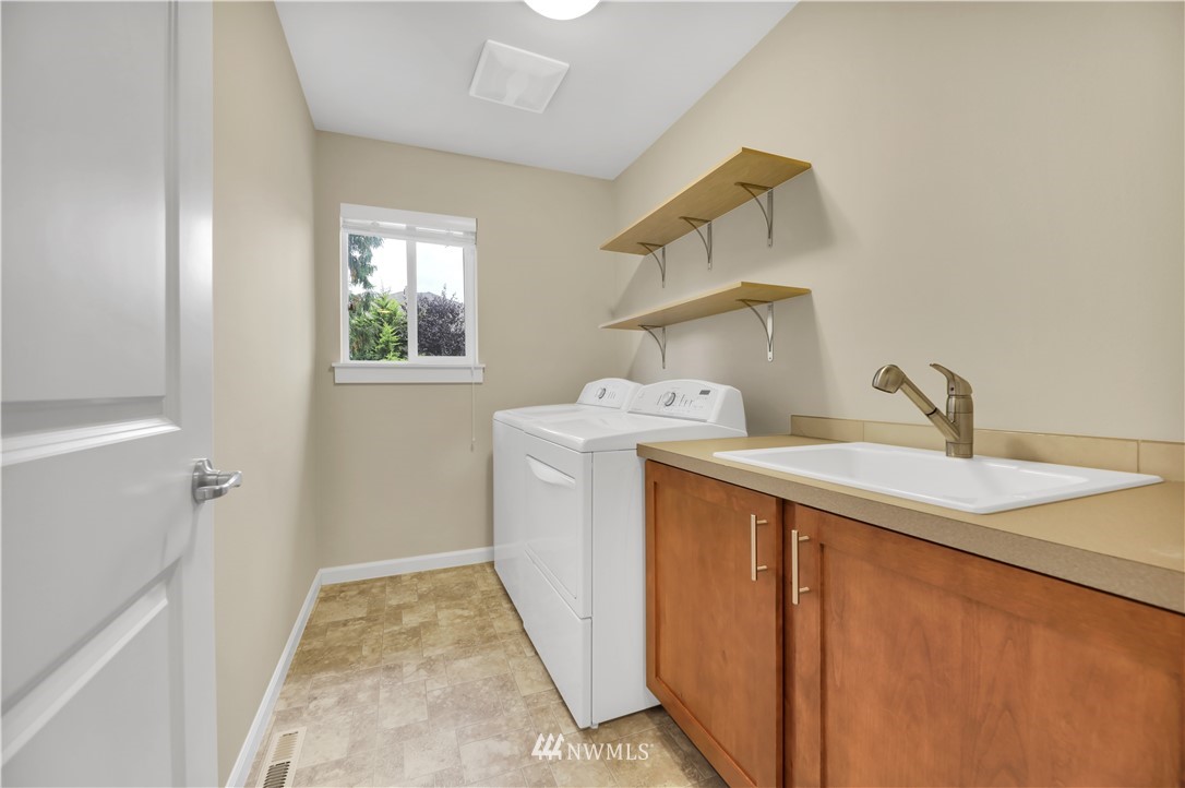 6117 Northeast 1st Street Renton, WA 98059 - Photo 15 of 39 a utility room with dryer and washer