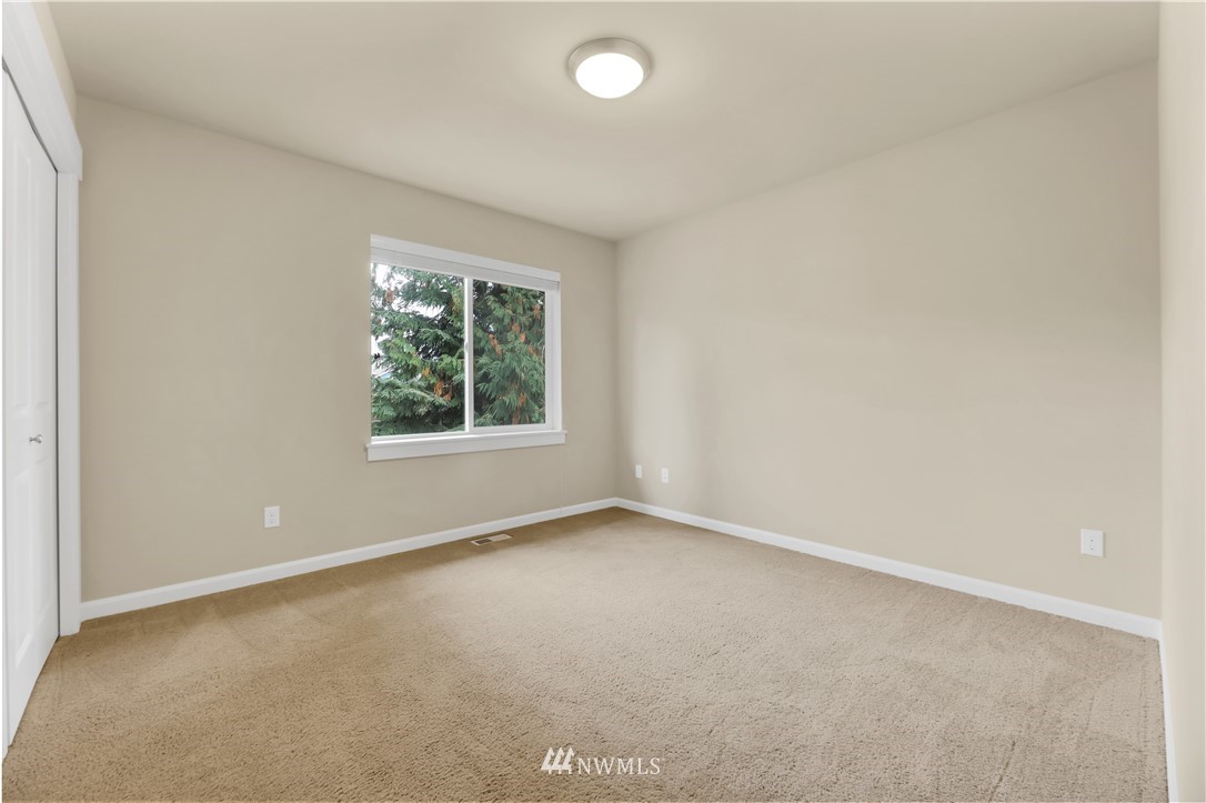 6117 Northeast 1st Street Renton, WA 98059 - Photo 21 of 39 an empty room with windows