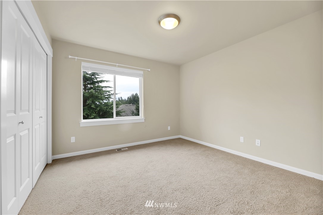 6117 Northeast 1st Street Renton, WA 98059 - Photo 23 of 39 an empty room with windows
